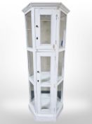 A painted and glazed hexagonal display cabinet,