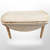 A pine drop leaf coffee table,