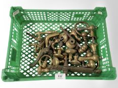 A crate of vintage brass door handles various