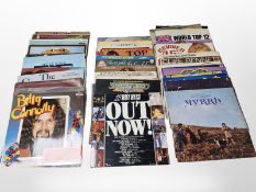 A collection of vinyl LP records, mostly compilations including Vangelis, The Commodores,