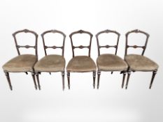 A set of five Victorian walnut dining chairs.