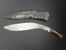 A Gurkha kukri knife in sheath.