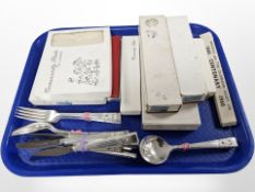 A quantity of boxed and unboxed EPNS cutlery, twin-handled sugar bowl and milk jug.