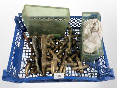 A crate of vintage brass door handles various