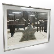 A continental colour print depicting figures in a street, indistinctly signed, 72cm x 49cm.