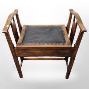 A late Victorian beech piano stool,