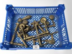 A crate of vintage brass door handles various