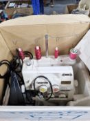 A Toyota electric sewing machine with lead and pedal.