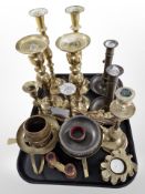 Several pairs of brass candlesticks, tealight holders, small pair of binoculars, gilt cutlery, etc.