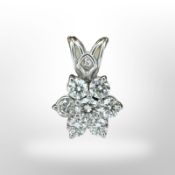 A white gold seven stone diamond cluster pendant, length 15mm CONDITION REPORT: 1.