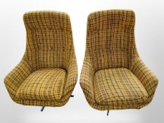 A pair of 20th century Danish swivel lounge chairs in checkered fabric