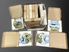 A group of 12 collector's plates in boxes depicting WW2 aircraft.