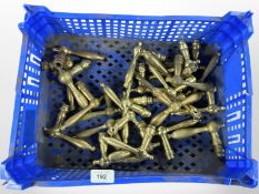 A crate of vintage brass door handles