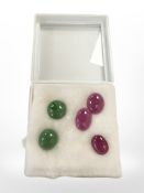 Three Burmese cabochon rubies, 6.01, 5.17 & 5.06ct, and two cabochon emeralds 8.35 & 6.36ct.