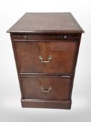 A reproduction mahogany two drawer pedestal cabinet,