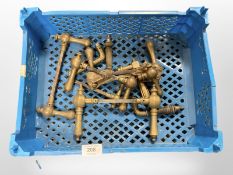 A crate of vintage brass door handles