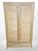 A contemporary oak double door wardrobe,