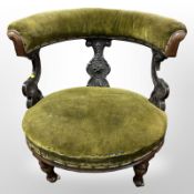 A Victorian carved mahogany salon chair in olive green velvet