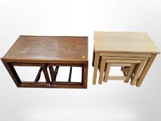 A teak nest of three tables and an oak effect nest of tables,
