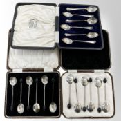 A boxed set of six silver teaspoons and two boxed sets of six silver coffee spoons