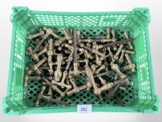 A crate of brass door handles