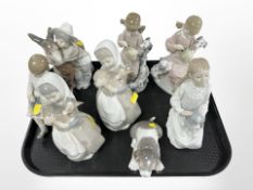 Eight various Lladró and Nao figures and figure groups, tallest 21cm.