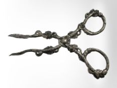 A highly ornate pair of Victorian silver sugar nips, by Hilliard and Thompson 1878.