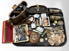 A group of collectables including lighters, binoculars, coins, pack of erotic playing cards,