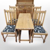 An oak barley twist pie crust edge drop leaf dining table,