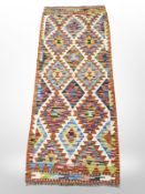 A Chobi Kilim runner, 151cm x 63cm.