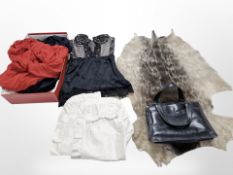 A group of vintage dresses, lady's black leather handbag, corset, synthetic animal pelt rug.