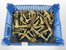 A crate of vintage brass door handles various