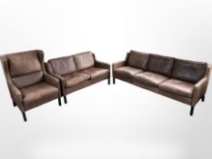 A late 20th century Danish Stouby brown leather three piece lounge suite comprising three seater
