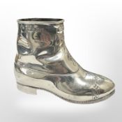 A large heavy silver pin cushion in the shape of a boot, John Grinsell & Sons,