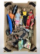 A group of Action Man figures and accessories.