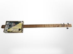 A three string cigar box guitar