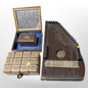 A La Marguerite auto harp, together with three wooden trinket boxes.