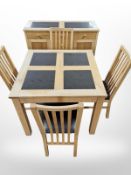 A contemporary oak and granite inset square dining table,