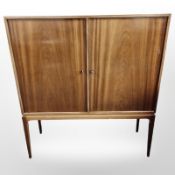 A 20th century Danish teak double door side cabinet,