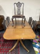 A reproduction mahogany extending two pedestal dining table, one leaf,