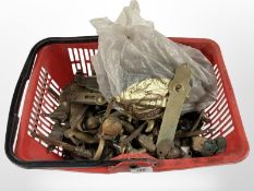 A tub of vintage brass door handles
