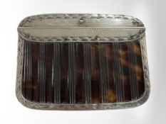 An antique silver and tortoiseshell purse.