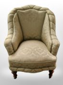 A 19th century walnut framed armchair in damask fabric