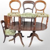A reproduction twin pedestal dining table in the Regency style,
