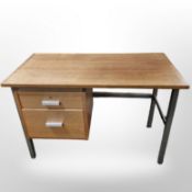 A Danish teak single pedestal desk on metal legs,
