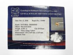 A natural loose fancy orangy yellow diamond, 0.