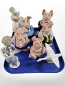 Five Wade Natwest pigs, a Lladró figure of a child holding a dog, a swan,