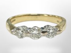 An 18ct gold three stone diamond ring, size K1/2 CONDITION REPORT: 3.