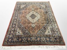 An Indian carpet of Tabriz design,