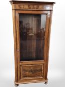 A 19th century continental walnut single door bookcase,